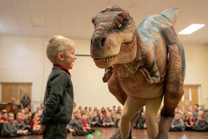 Jam the T-Rex playing with a little boy